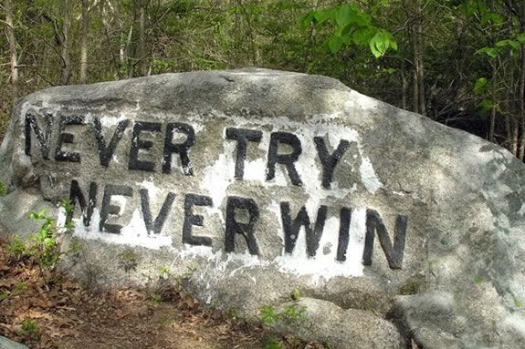 Never Try Never Win is just one of the boulders commision for carving by Roger Babson